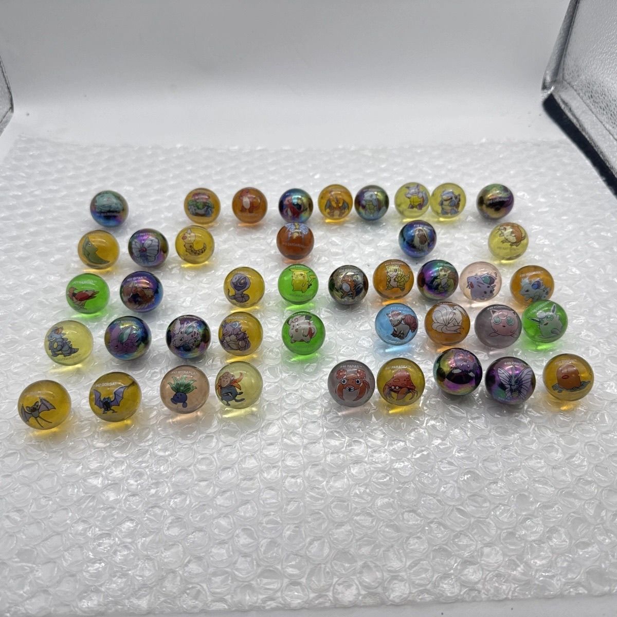 Merchandise oficial Pokémon em - Vintage Collectible Marbles avaliação e preço